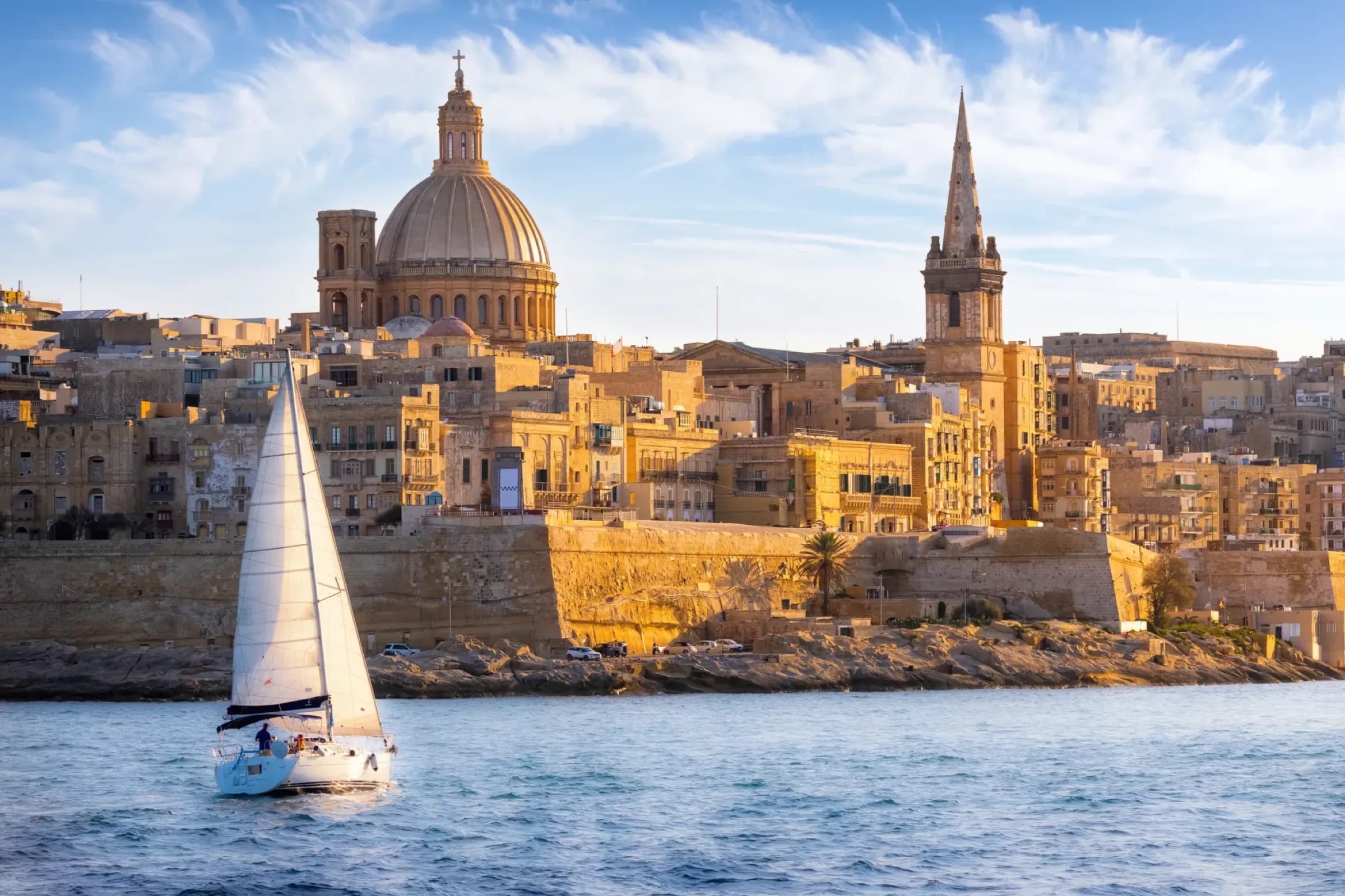 Valletta harbor, Malta, with honey-colored limestone fortifications above the Mediterranean