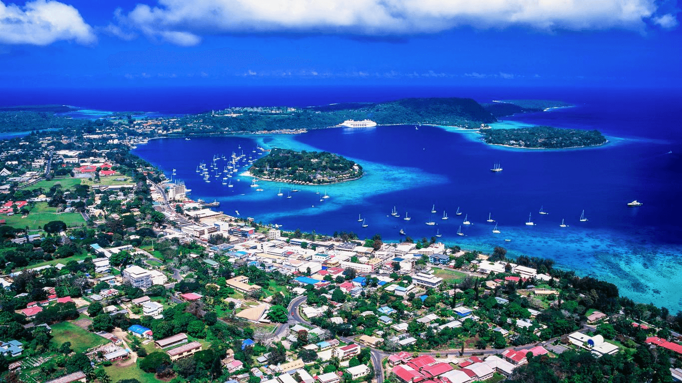 Overwater bungalows on Efate Island, Vanuatu, with turquoise South Pacific lagoon